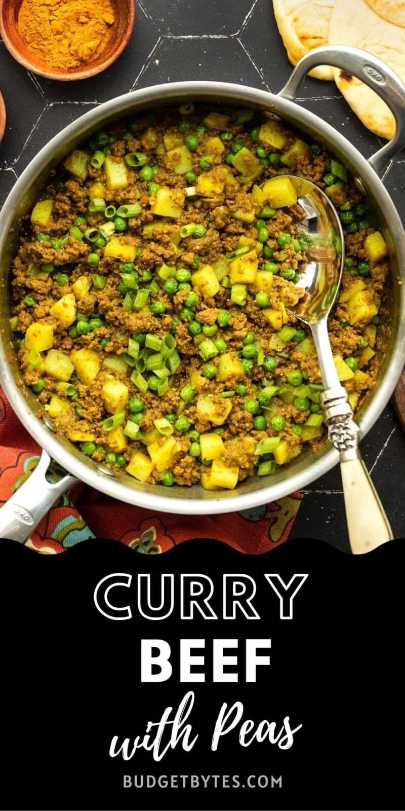 a skillet full of curried ground beef with peas and potatoes, title text at the bottom