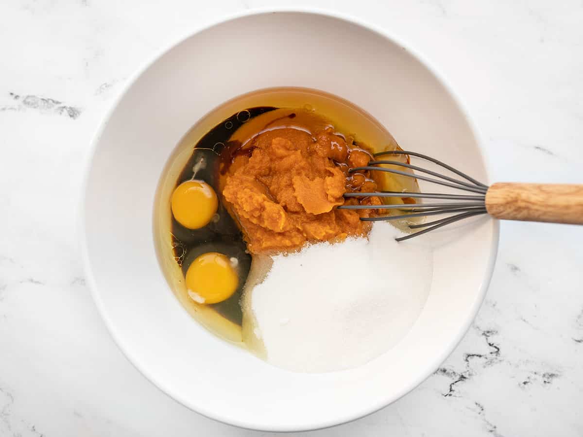 wet ingredients in a bowl with a whisk