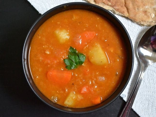 Red lentil stew served in a bowl.