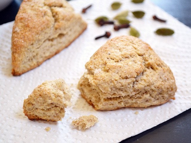 Crumbled chai scones with spices on a plate.