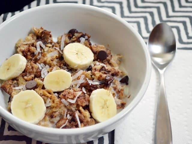 Bowl of Funky+Monkey+Oats with spoon on the side 