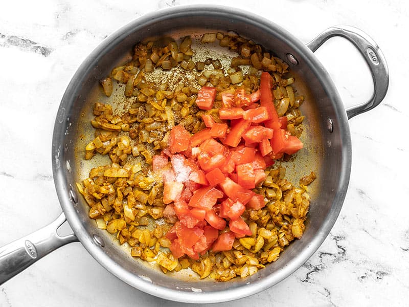 Tomato and Salt added to skillet