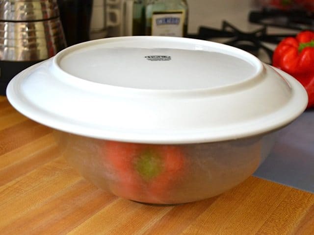 cooked pepper placed in sealed container to steam 