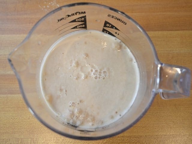 foamy yeast in measuring cup 