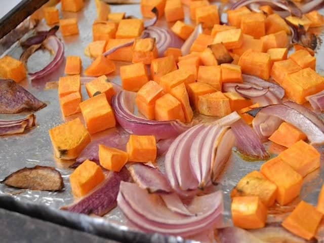 roasted sweet potato onion on baking sheet 