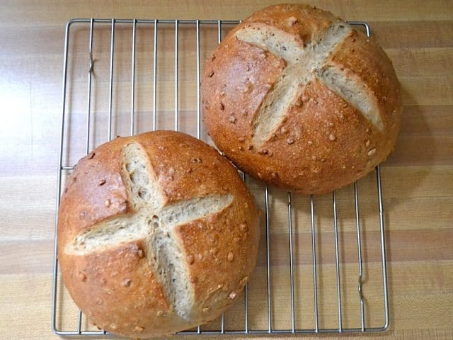 Top view of two Honey Sunflower Bread loaves on cooling rack 