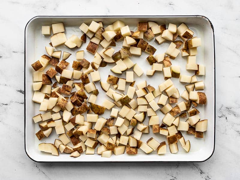 Diced potatoes on a baking sheet