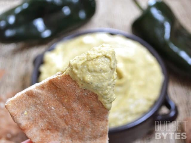 Pita bread dipped in Roasted Poblano Hummus