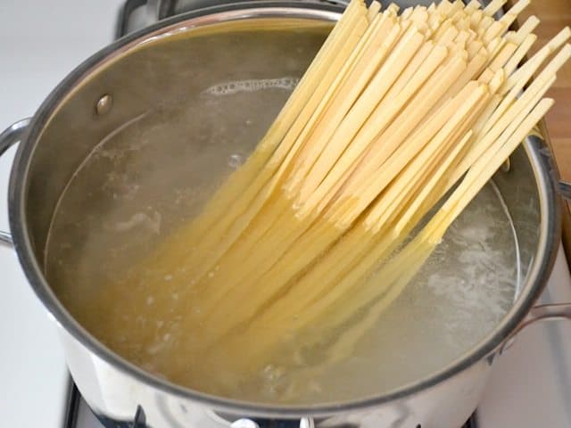 Pasta added to pot of boiling water 