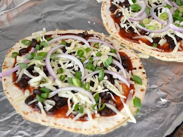 Onions added to top of pizzas 