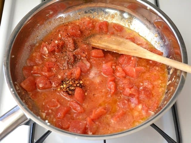 Tomatos and Pepper in skillet to make sauce