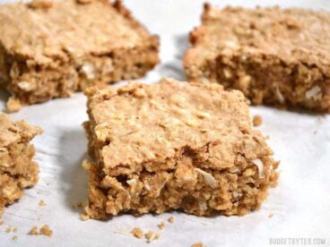 These Soft Oat and Nut Bars are a great grab and go breakfast. Not too sweet and full of whole wheat flour, nutritious oats, and protein packed nuts. BudgetBytes.com