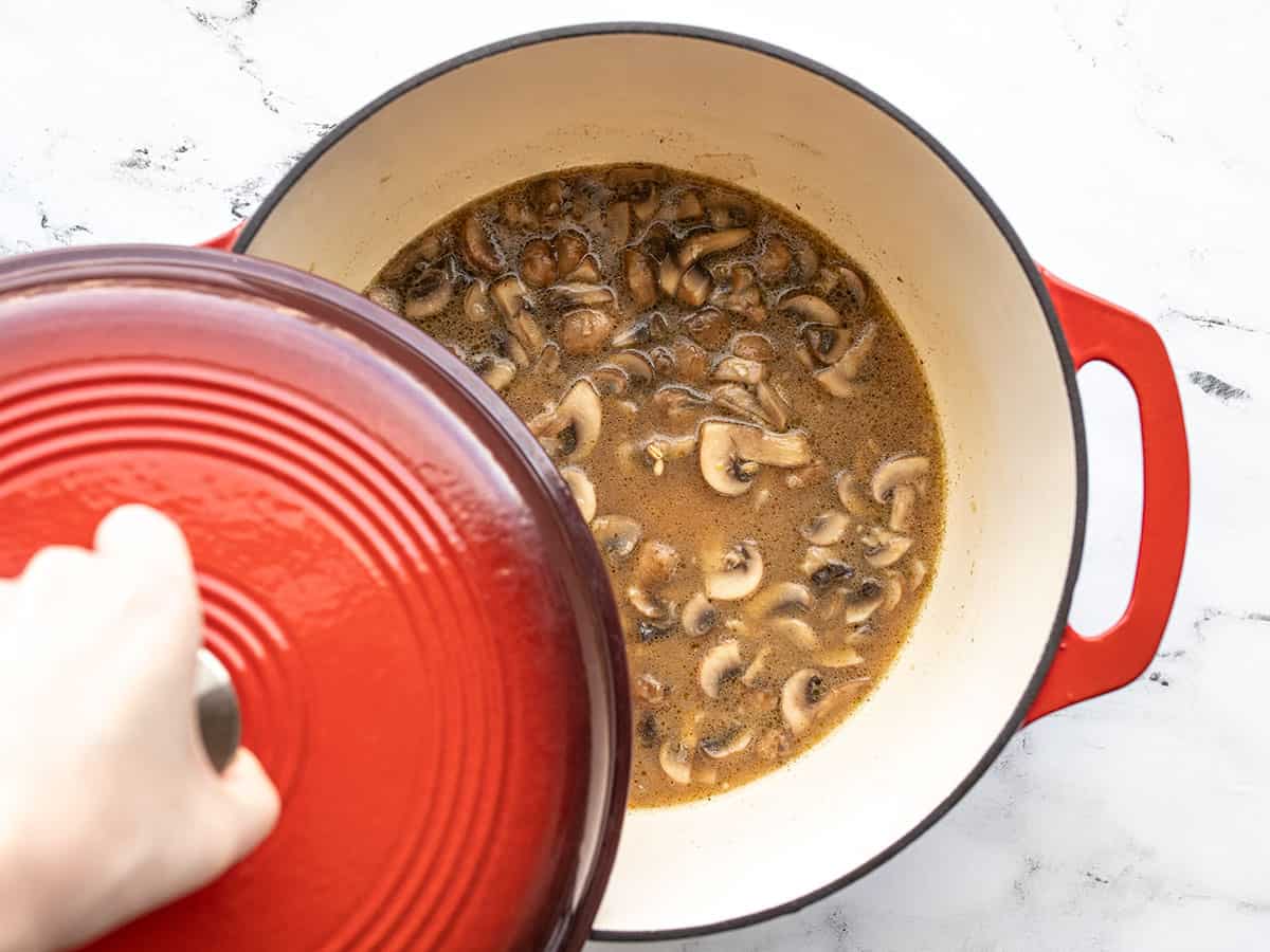 lid being placed on the pot