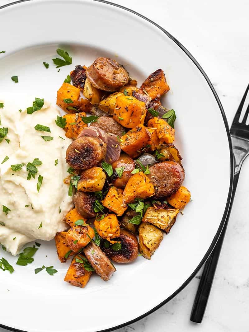 Oven Roasted Autumn Medley on a plate with mashed potatoes and a black fork on the side