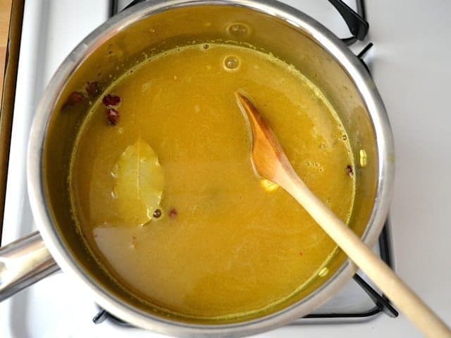 Water, cashews and cranberries added to pot 