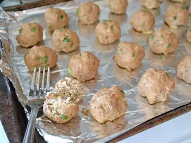 Baked Meatballs, one broken into with fork to make sure middle is cooked 