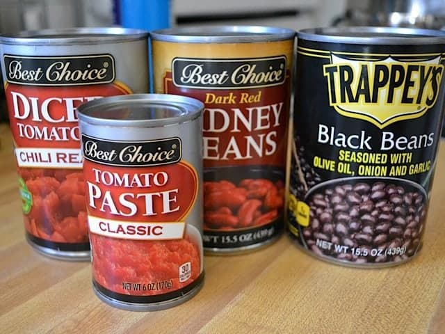 Caned Goods on countertop (tomatoes and black beans)