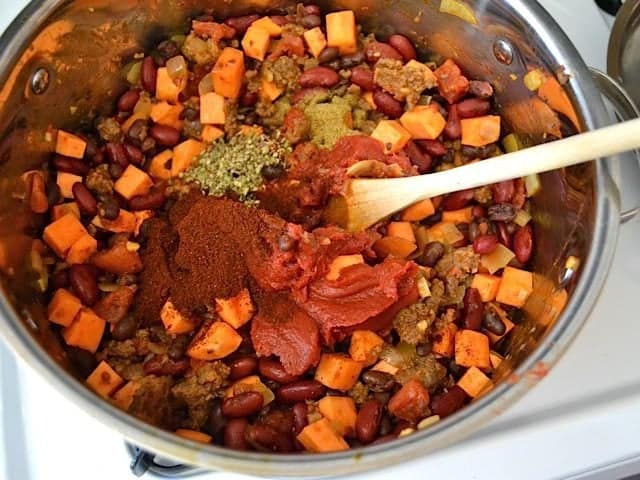 Seasoning and water added to other ingredients in pot 