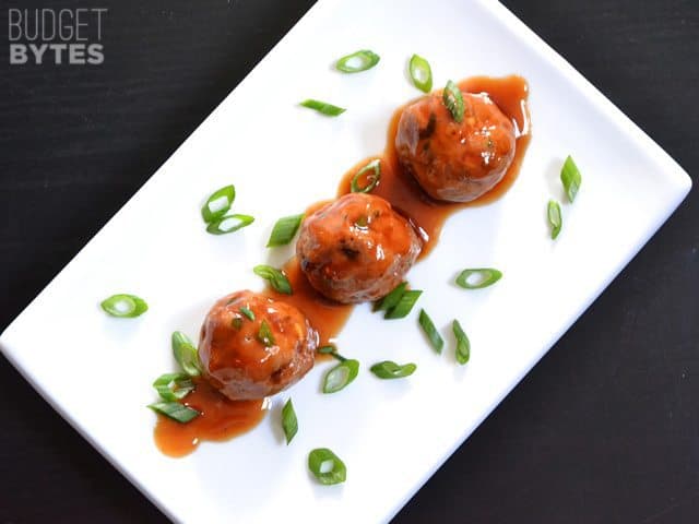 Three Turkey Sriracha Meatballs on a white plate 