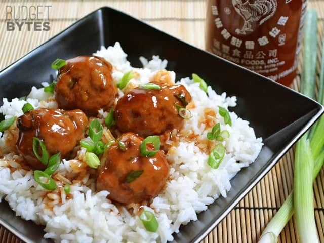 Turkey Sriracha Meatballs over white rice in a bowl 