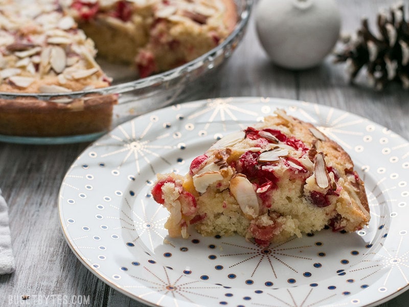 One slice of Cranberry Almond Cake on a plate 