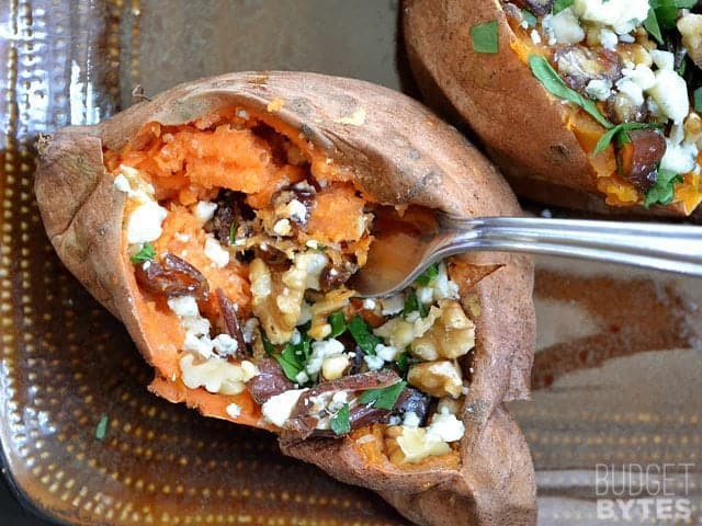 Fork scooping bite of sweet potato out 