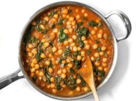 These super fast Curried Chickpeas with spinach are packed with flavor and nutrients, vegan, gluten-free, and filling! Plus they freeze great! BudgetBytes.com