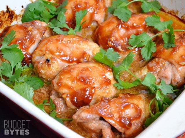 Sriracha-glazed chicken thighs on a plate.