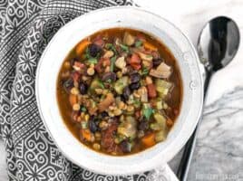 A bowl of chunky lentil and vegetable soup.