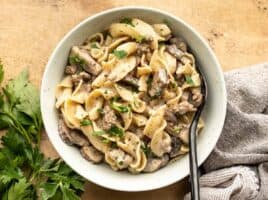 Overhead view of a bowl full of beef and mushroom stroganoff