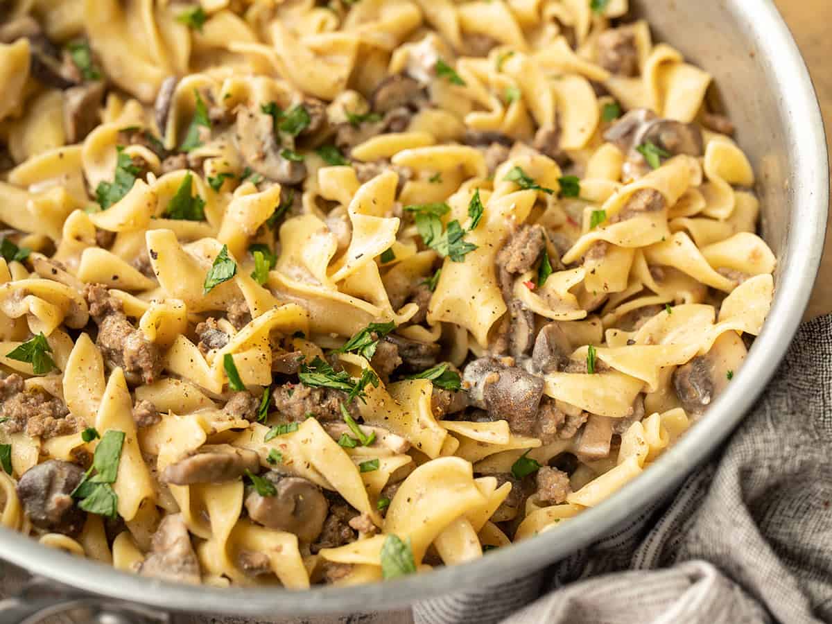 close up side view of beef and mushroom stroganoff in the skillet