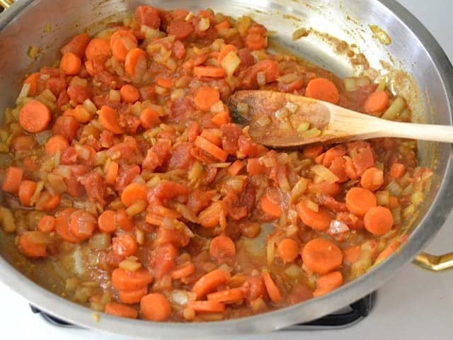 Tomatoe paste and diced tomatoes added to skillet 