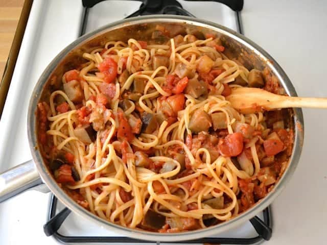 Cooked pasta added to skillet with sauce mixture 