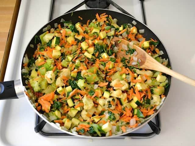 Reminder of veggies added and mixture continued to cook on stovetop 