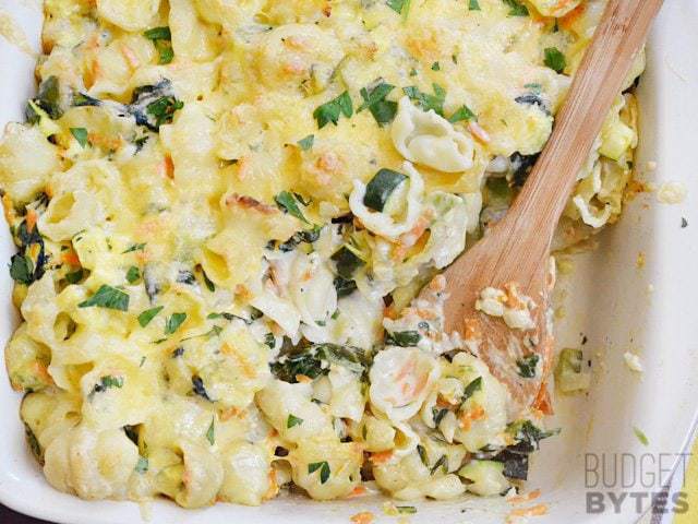 A baked veggie alfredo dish served in a baking dish.