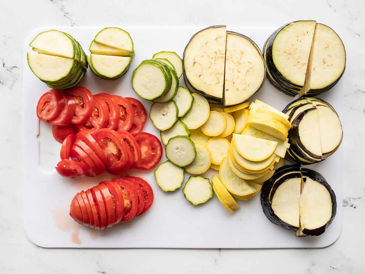 Sliced eggplant, squash, zucchini, and tomatoes