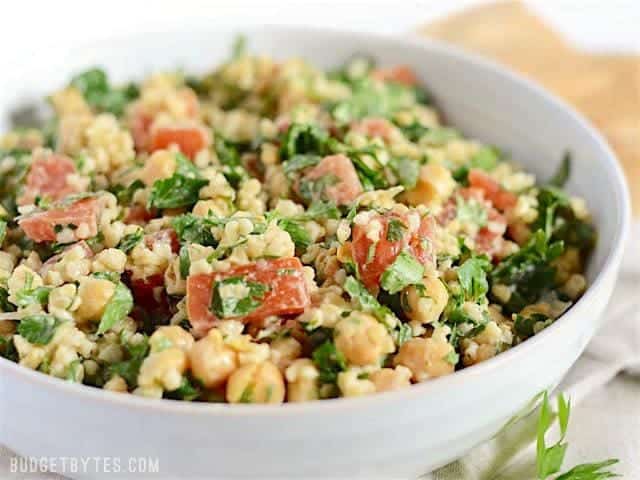 A close-up of falafel salad with fresh vegetables.