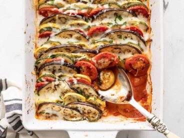 oven roasted ratatouille with a portion scooped out of the corner