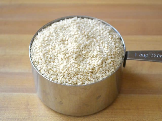 Sesame Seeds in measuring cup 