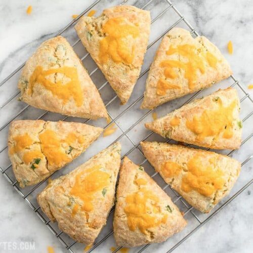 These soft, flakey Cheddar Scallion Scones are a breeze to prepare and make a great side for soups, stews, and chili! BudgetBytes.com