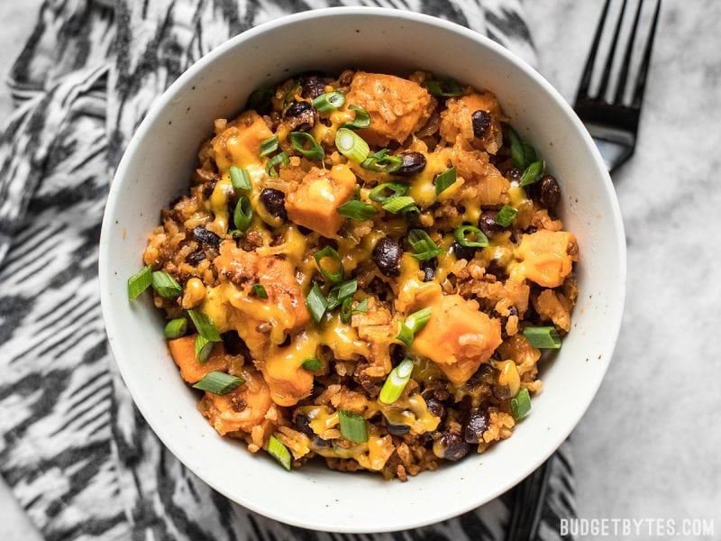 Top view of a bowl of chorizo and sweet potato skillet with a fork on the side 