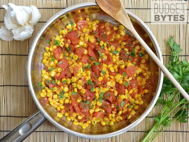 Sautéed Corn and Tomatoes with parsley sprinkled on top 