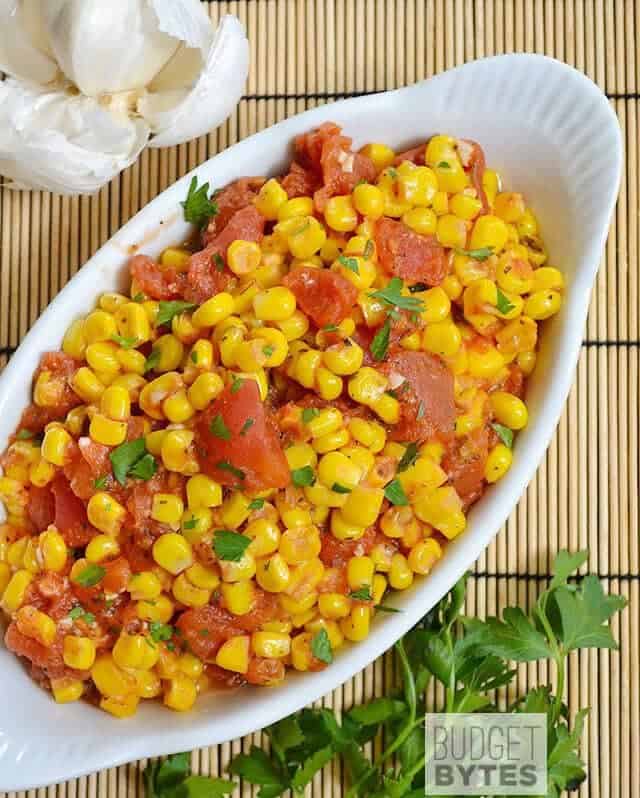 Top view of Sautéed Corn and Tomatoes in white dish 