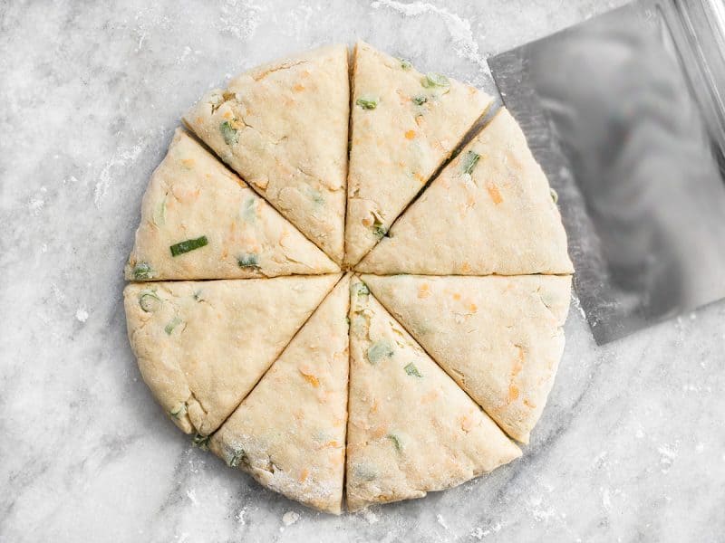 Cheddar Scallion Scones cut into triangles 