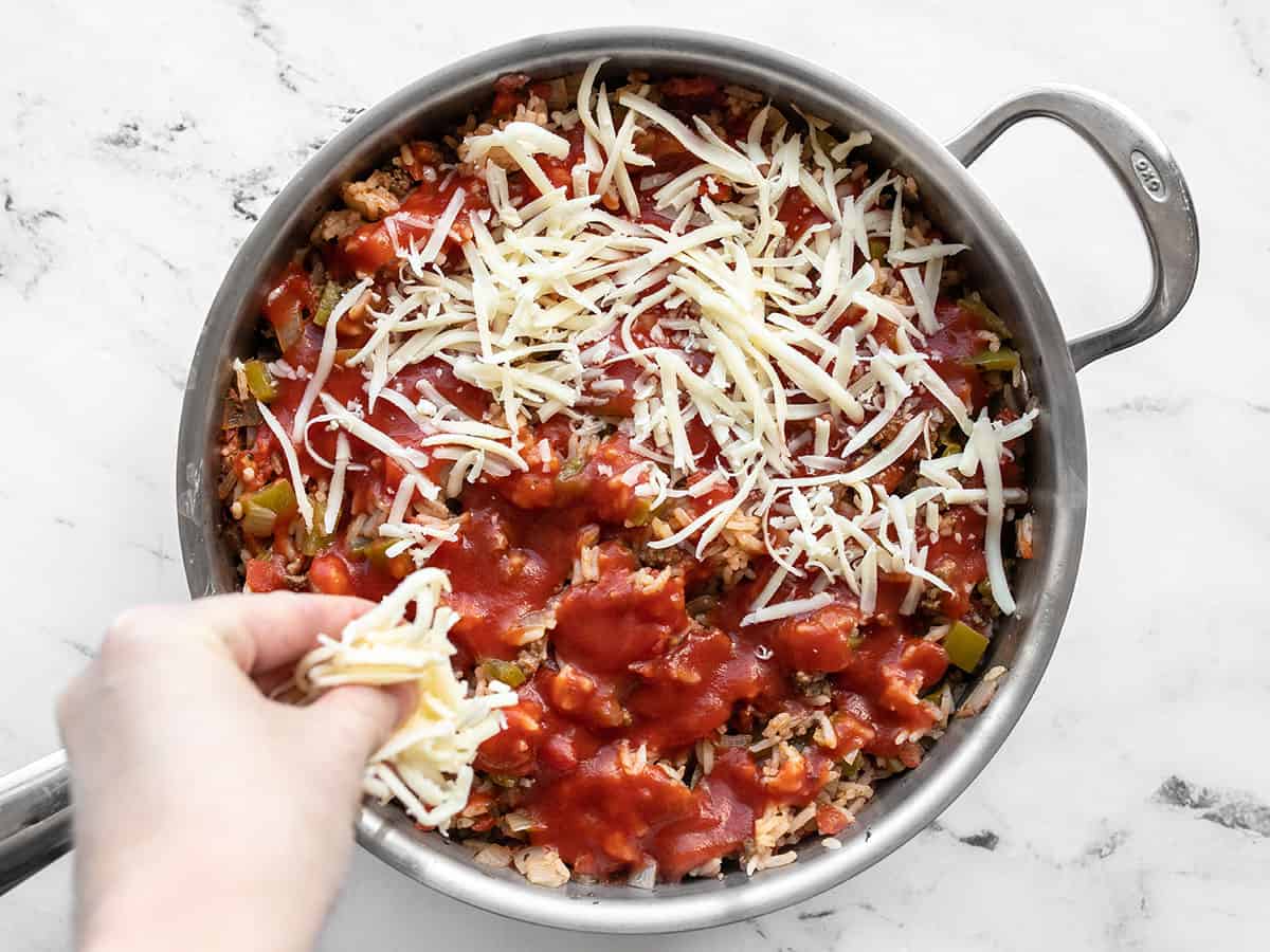 Cheese being added to the skillet