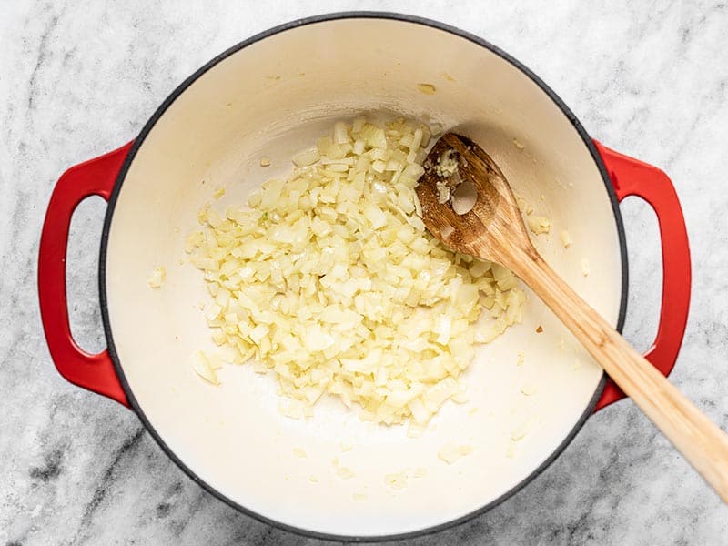 Sautéed onion, garlic, and ginger in a dutch oven