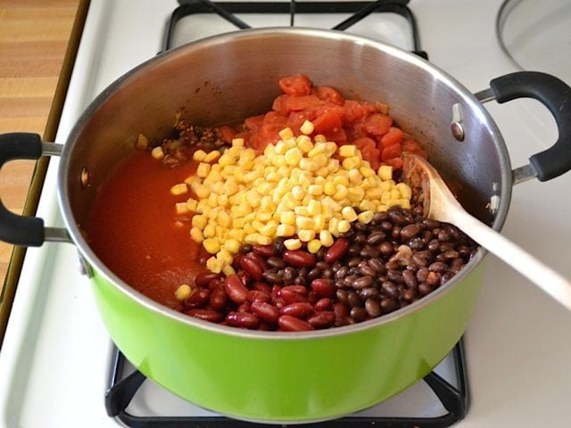 Add beans, tomatoes, corn to pot