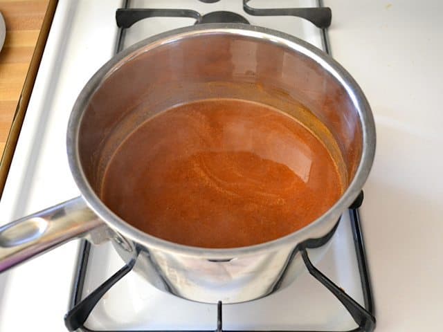 Red Enchilada Sauce in pot on stove top 