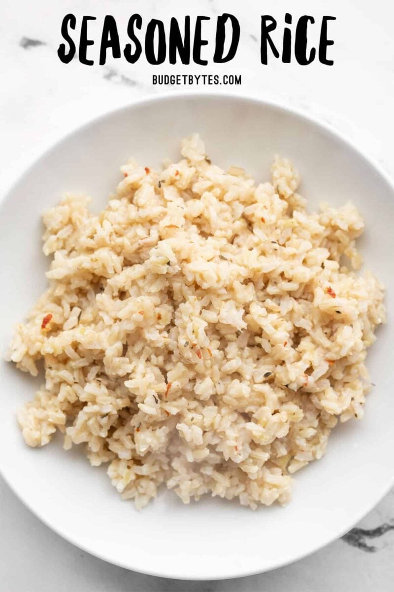 Overhead view of a bowl full of seasoned rice with title text at the top