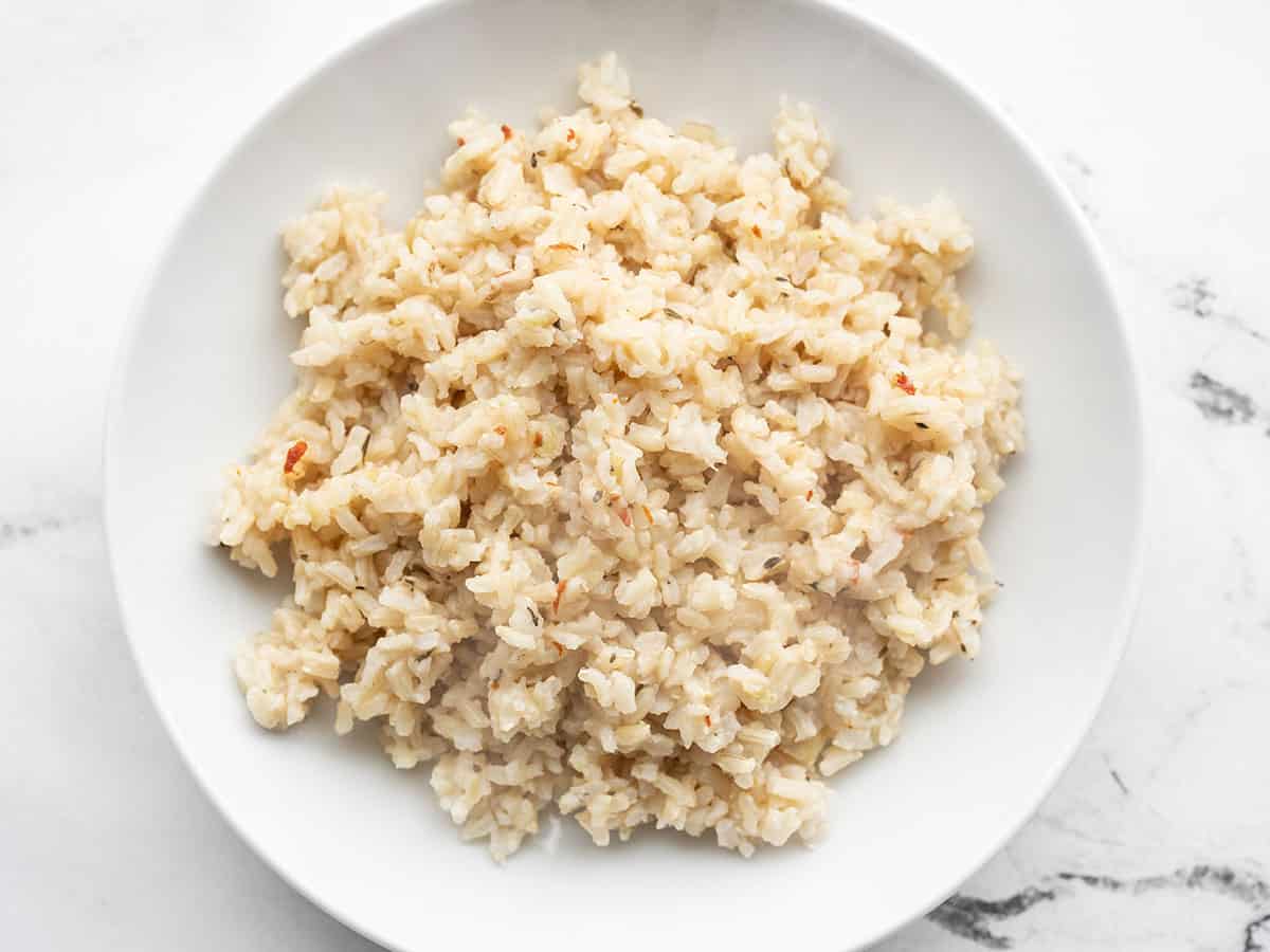 Overhead view of a bowl full of seasoned brown rice